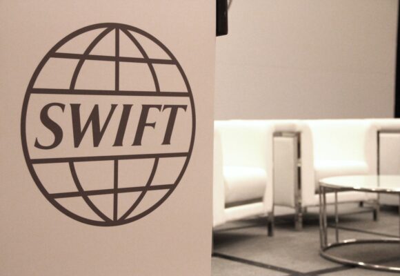 Inside the high-stakes battle between digital dollars and Swift’s massive money engine